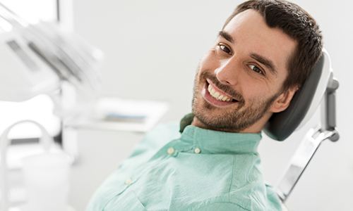 Closeup of man smiling in dentist's treatment chair