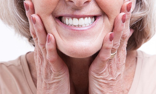 closeup of patient smiling with dentures