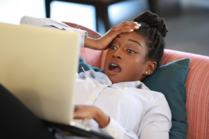 Woman surfing the web is shocked about surprising cavity-causers